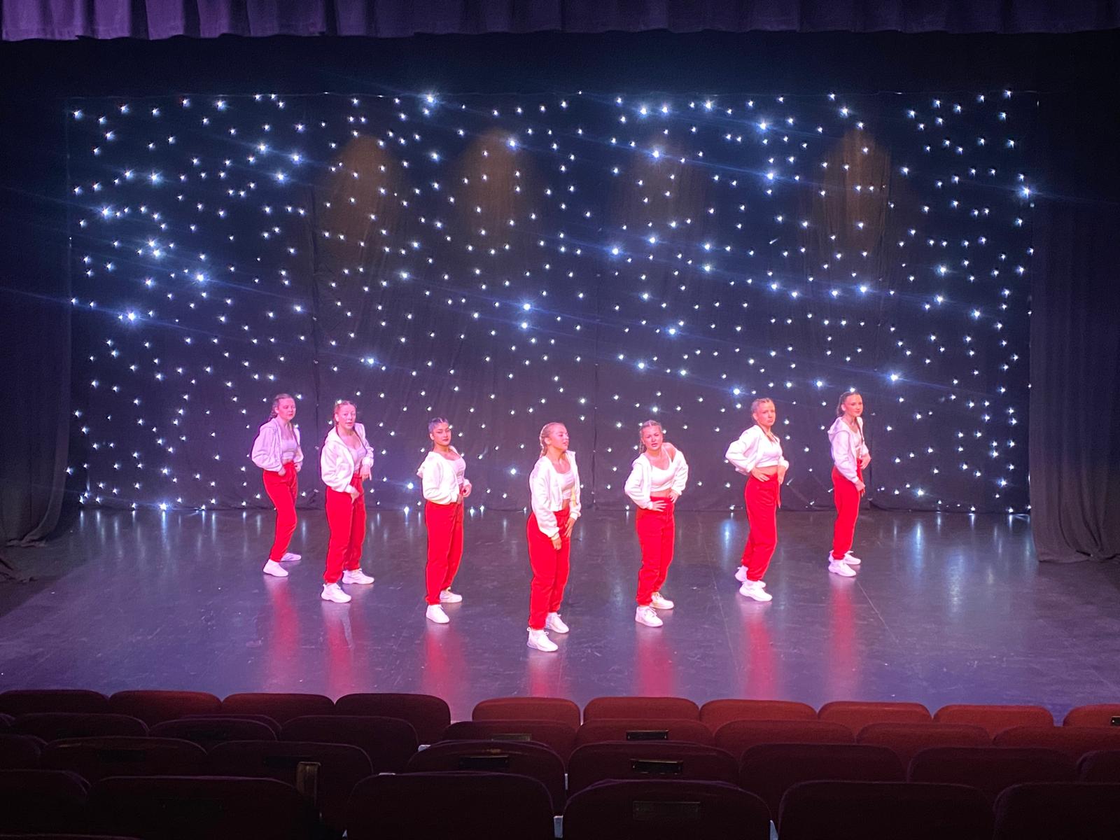 Students performing colourful group routine at Clairemarie’s annual show